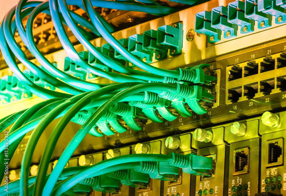 network cables and hub closeup with fiber optical background network cables and hub closeup with fiber optical background