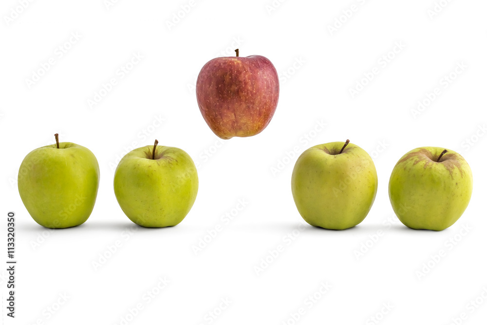 Single red apple above a row of ripe green apples isolated on white background Single red apple above a row of ripe green apples isolated on white background