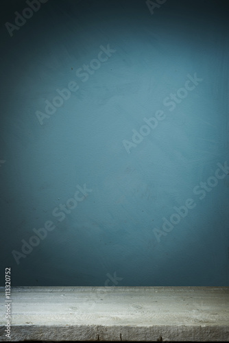 Wallpaper Mural Background with wooden table and grunge blue wall Torontodigital.ca