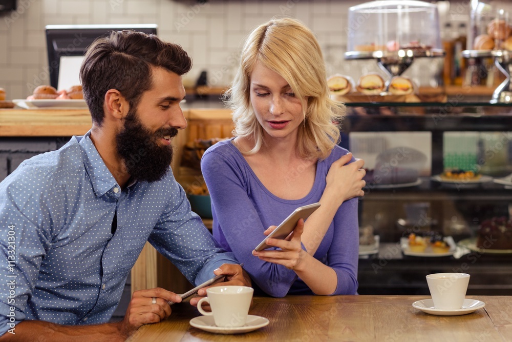 Couple using smartphones Couple using smartphones
