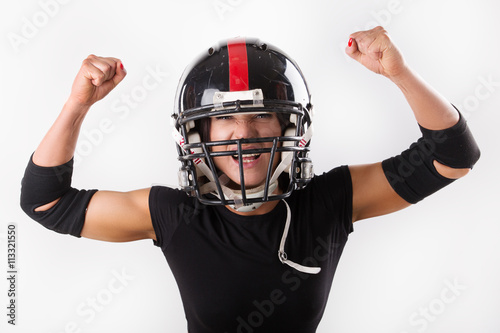 Young woman with football helmet and protection suit on a white