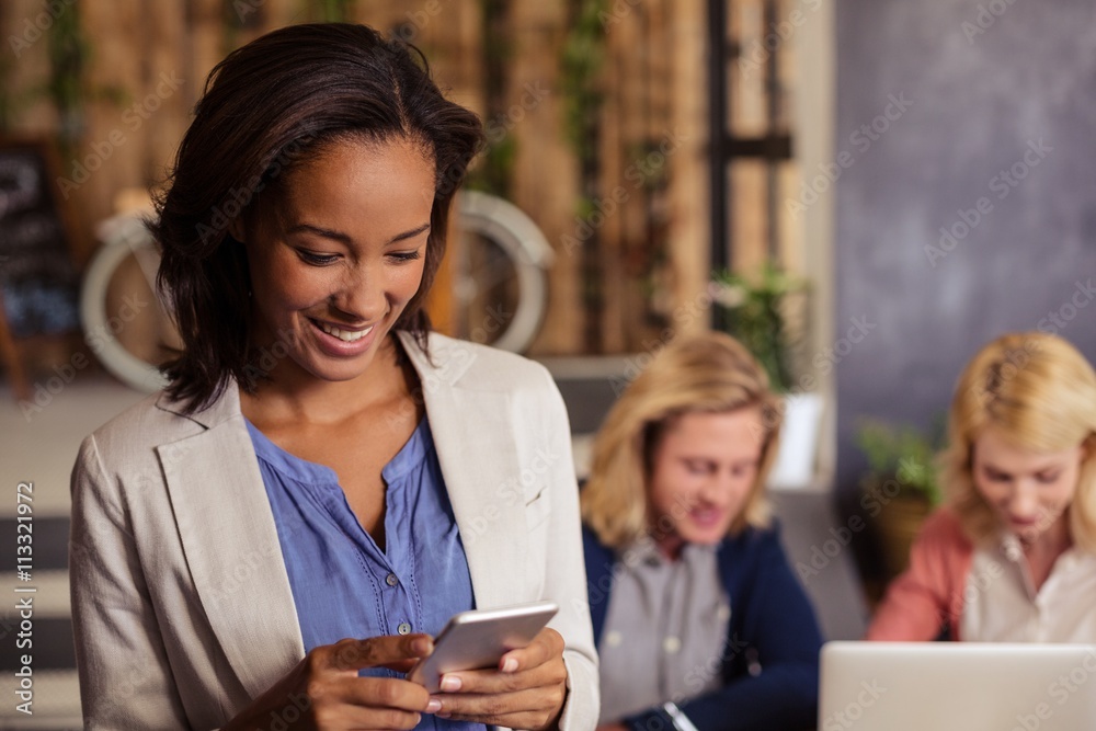 Smiling businesswoman using a smartphone Smiling businesswoman using a smartphone