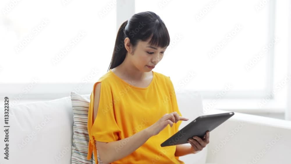 happy asian woman with tablet pc and credit card happy asian woman with tablet pc and credit card