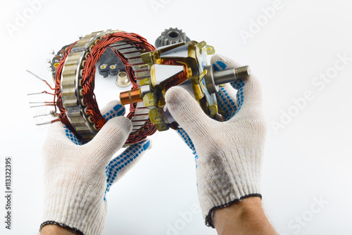Fotografie The electrical part of the generator in the hand