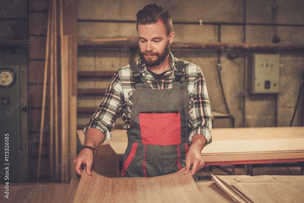 Carpenter doing his job in carpentry workshop. Carpenter doing his job in carpentry workshop.