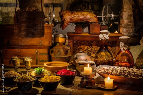 Fotografie, Obraz Medieval ancient kitchen table with typical food in royal castle.