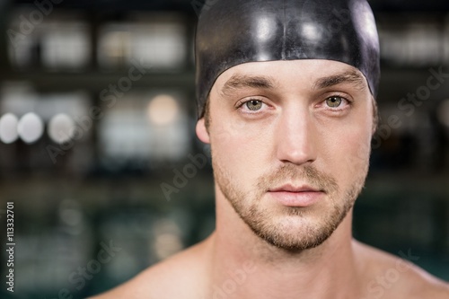 Canvas Print Portrait of swimmer standing by the pool