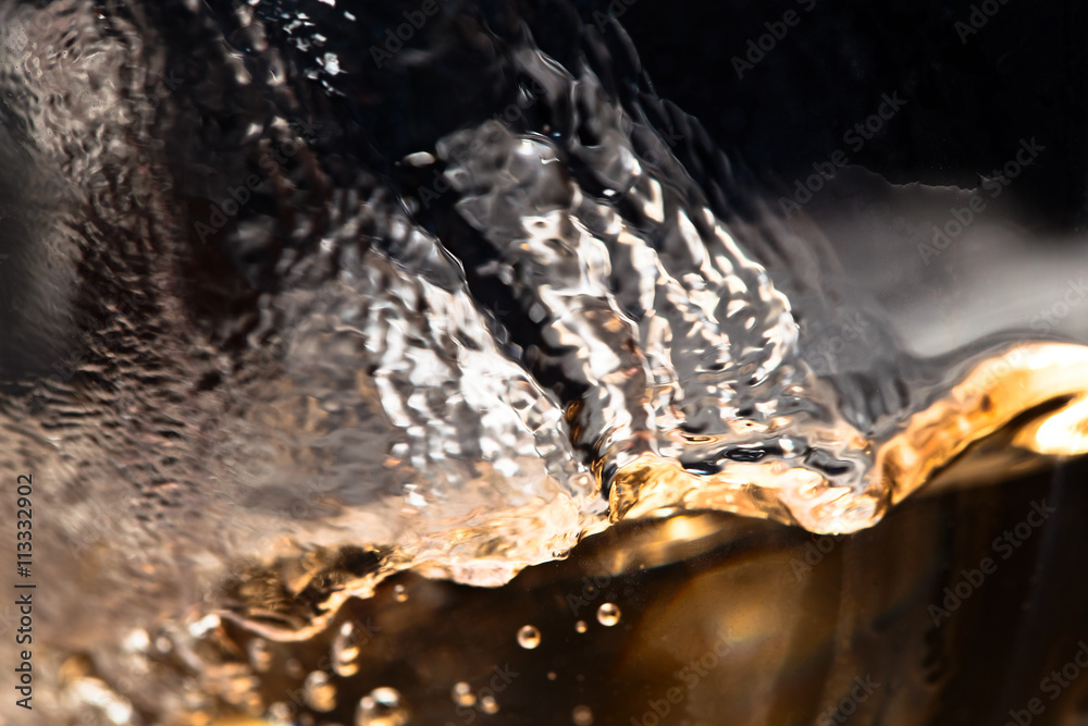 white wine in glass on black background white wine in glass on black background