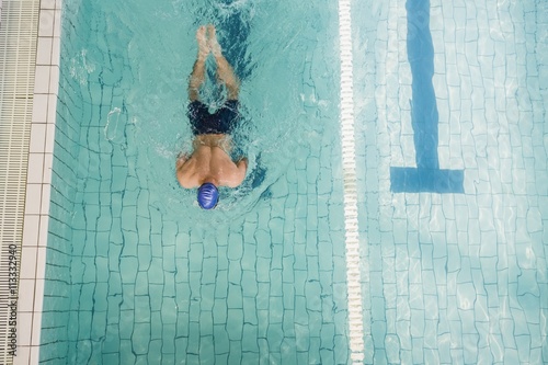 Swimmer doing the breaststroke in swimming pool