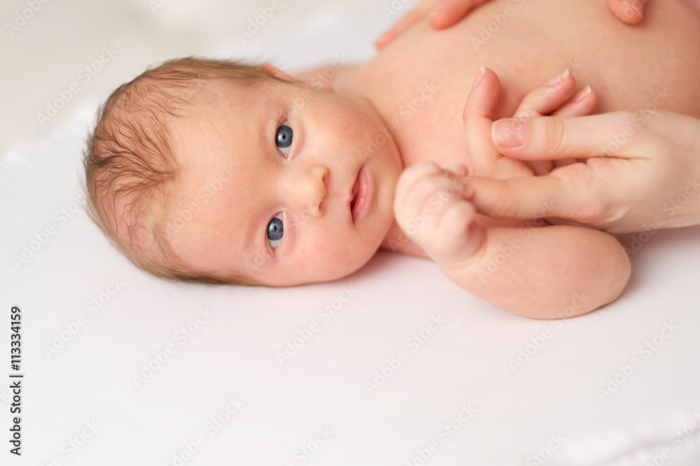 One month old newborn baby with mother One month old newborn baby with mother