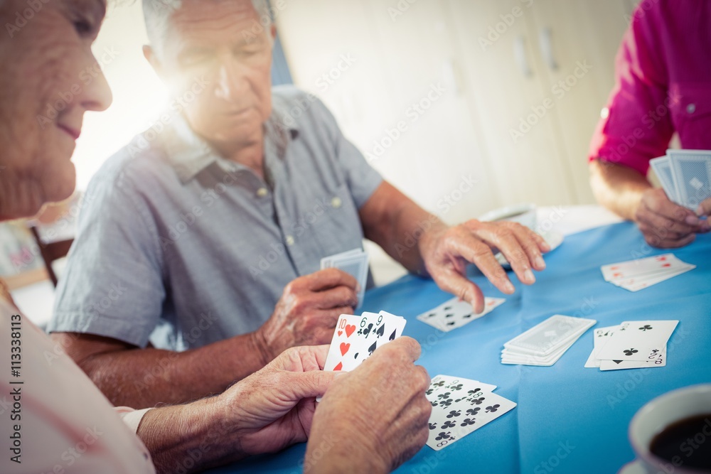 Group of seniors playing cards Group of seniors playing cards