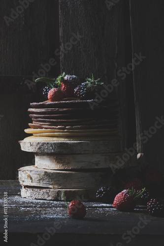 Quadro em tela Breakfast in the wood : chocolate pancakes with strawberries and