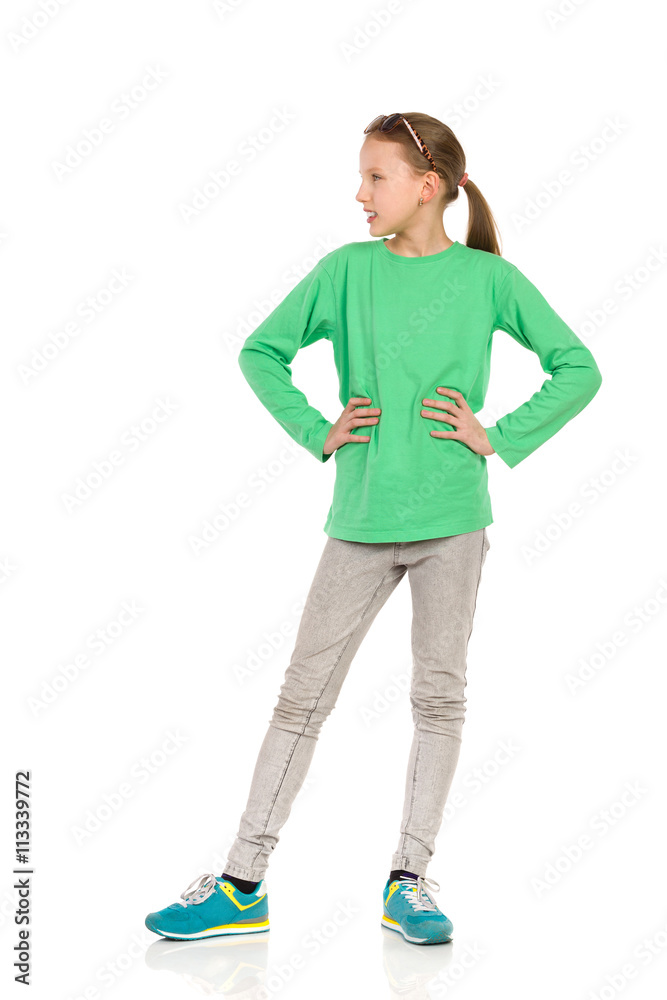 Child Girl Posing With Hands On Hip And Looking Away Child Girl Posing With Hands On Hip And Looking Away