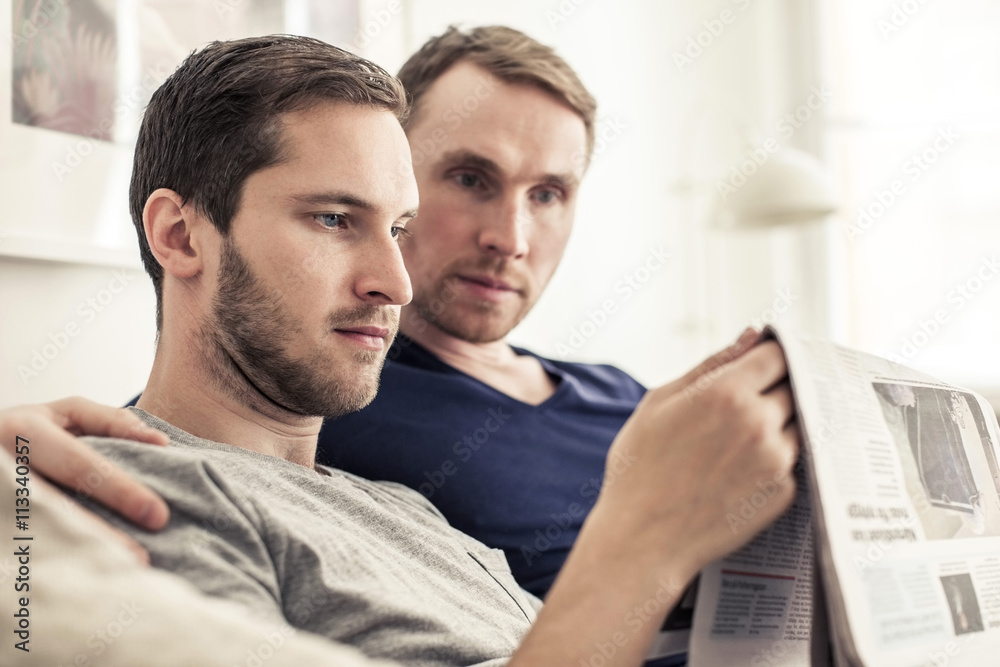 Two men reading newspaper Two men reading newspaper