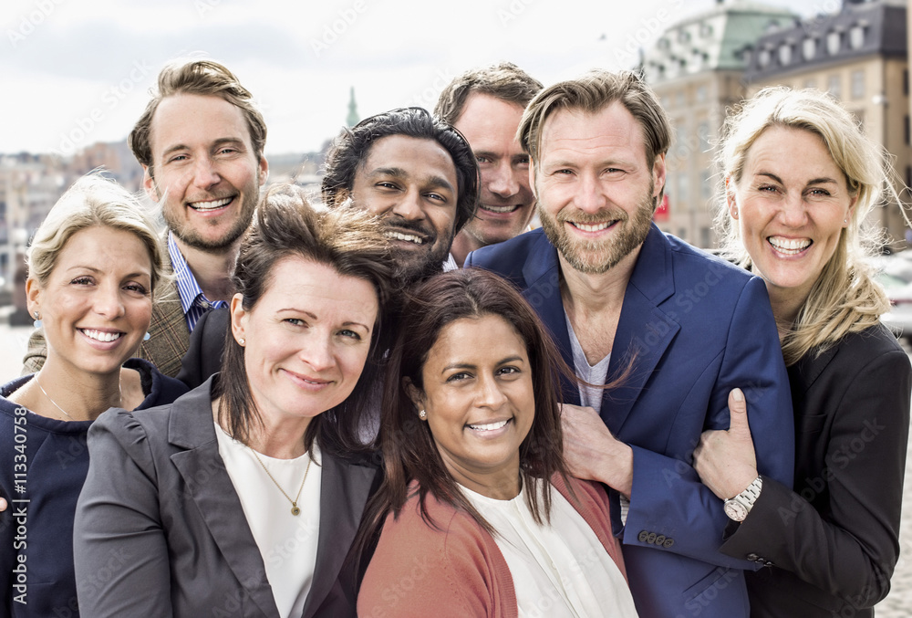 Portrait of happy multi-ethnic business people standing together outdoors Portrait of happy multi-ethnic business people standing together outdoors