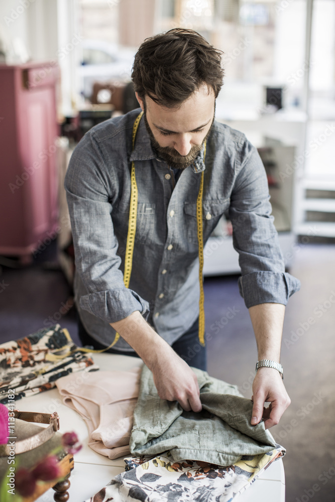 Male tailor preparing shirt