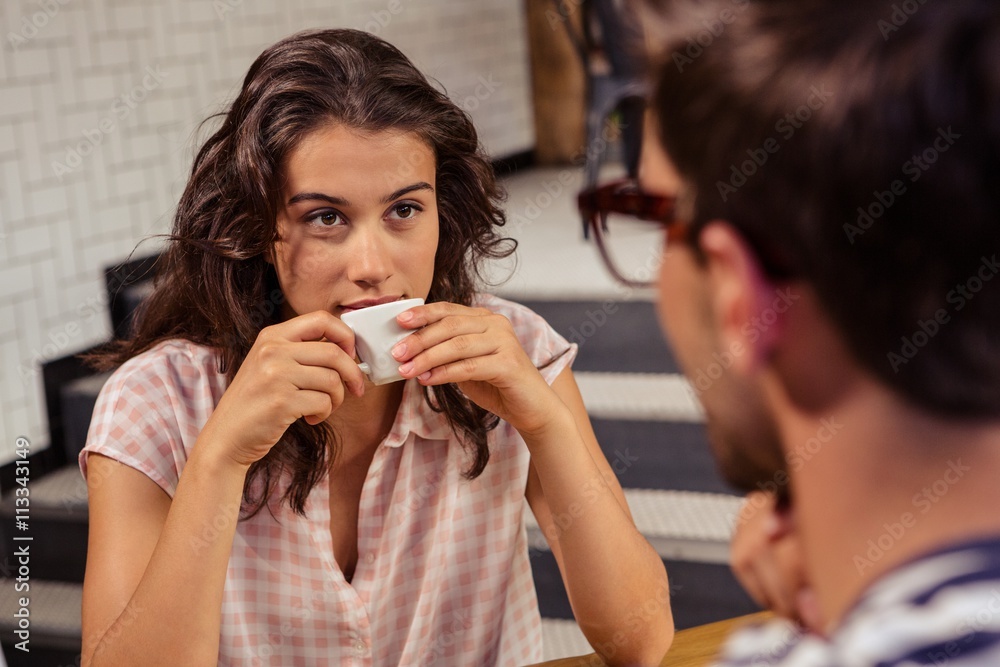 Young woman having coffee in cafeteria Young woman having coffee in cafeteria