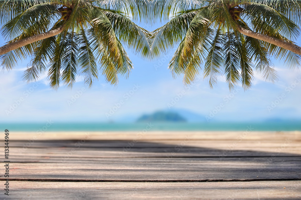 Coconut palm tree with plank on tropical beach background, happy summer holiday concept and display products idea