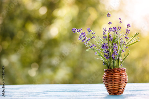 Fototapeta Naklejka Na Ścianę i Meble -  bouquet of lavender on a wooden table outdoors