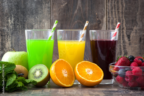 Fresh fruit smoothies on a rustic wooden background

