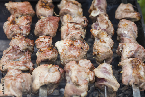 fresh grilled meat on skewers closeup
