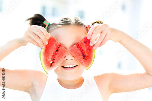 Girl is eating watermelon