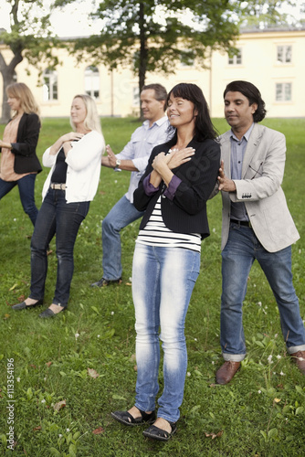 Group of mature peolpe doing trust exercise