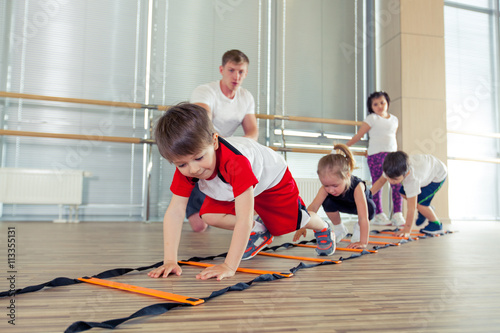 Happy sporty children in gym.