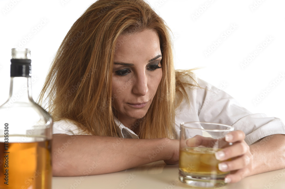 caucasian blond wasted and depressed alcoholic woman drinking scotch whiskey glass messy drunk caucasian blond wasted and depressed alcoholic woman drinking scotch whiskey glass messy drunk