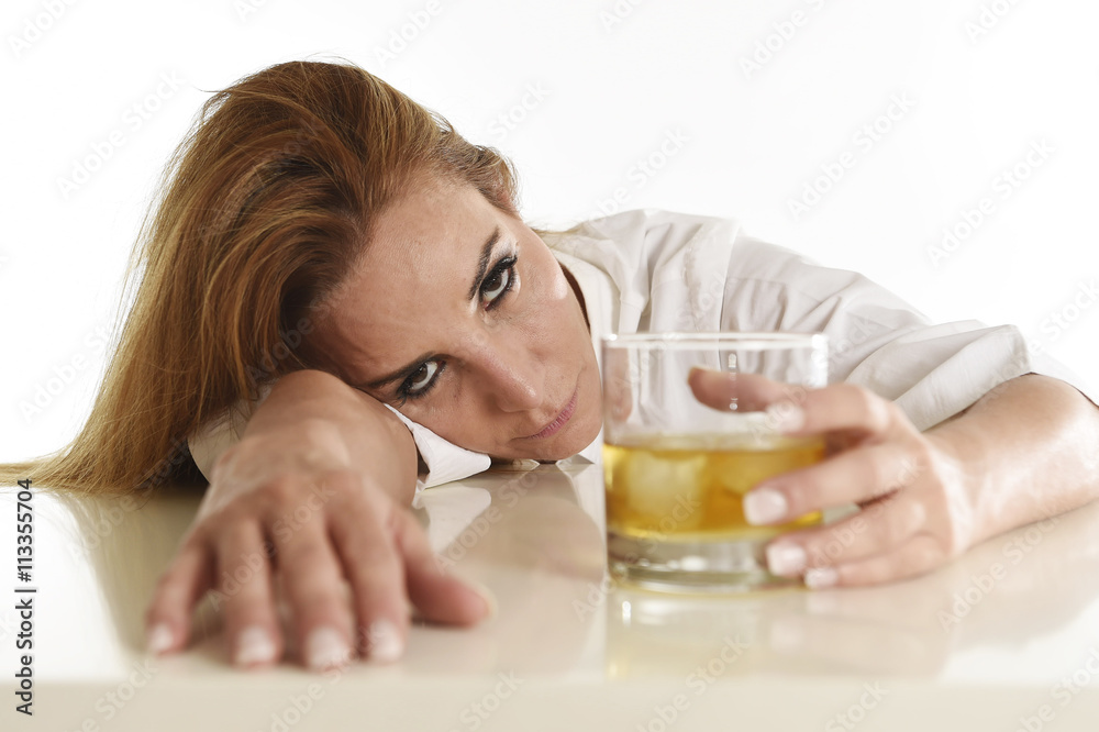 caucasian blond wasted and depressed alcoholic woman drinking scotch whiskey glass messy drunk caucasian blond wasted and depressed alcoholic woman drinking scotch whiskey glass messy drunk
