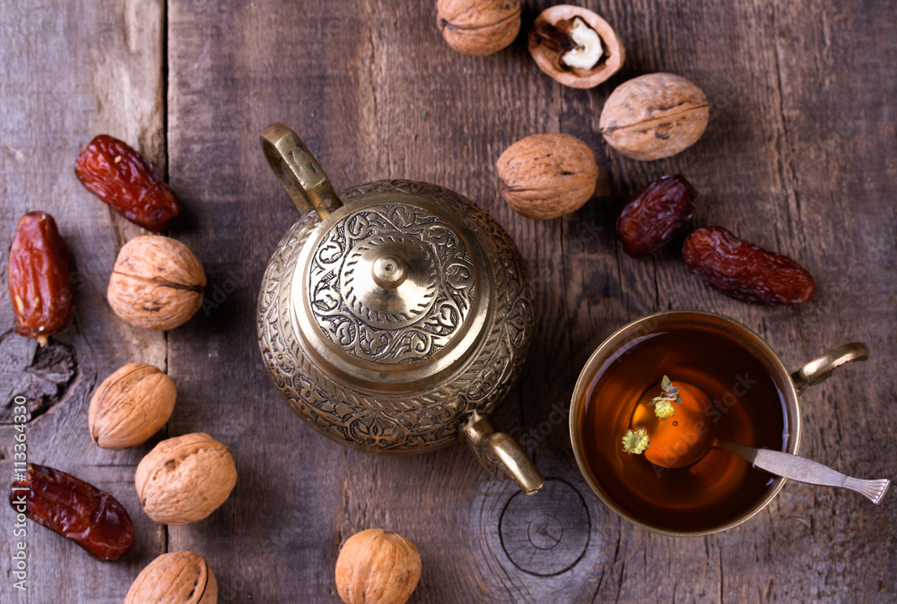 Traditional arabic tea set and dried dates. Traditional arabic tea set and dried dates.