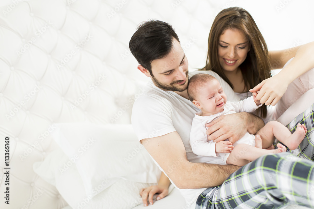 Happy family with newborn baby