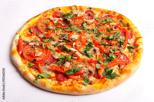 Pizza with salami, tomatoes, paprika and mushrooms isolated on white