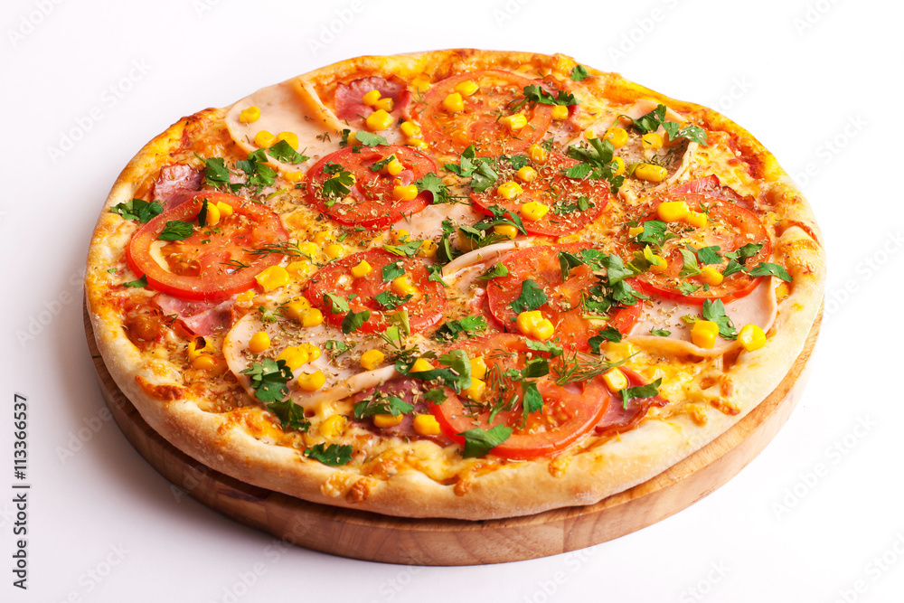Pizza with ham, tomatoes and corn isolated on white