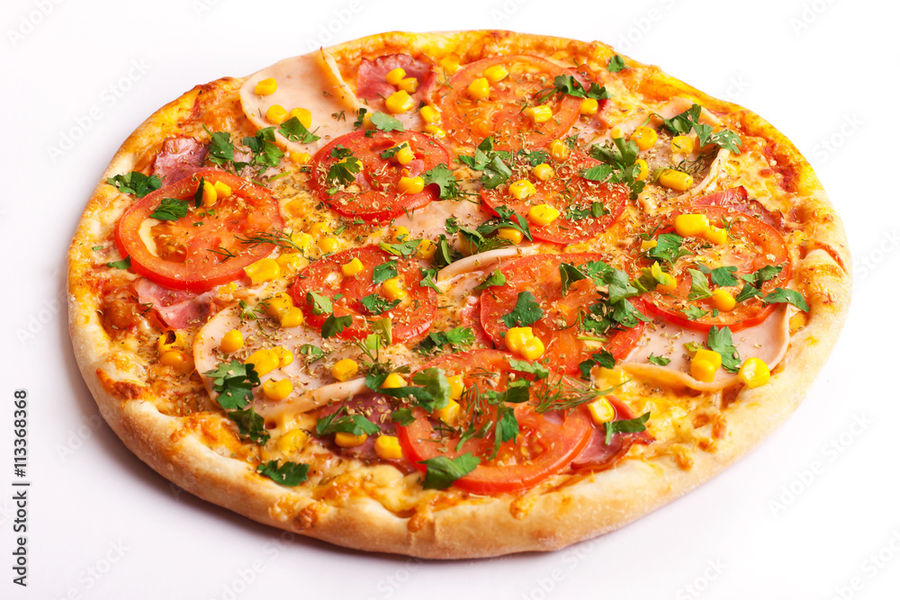Pizza with ham, tomatoes and corn isolated on white