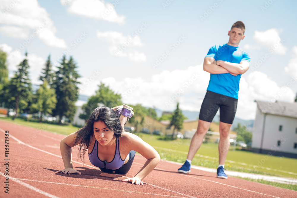 Push-ups with trainer outdoor