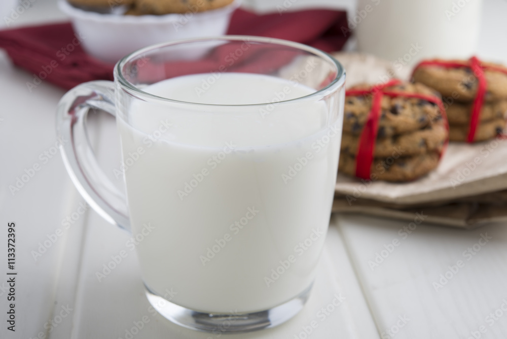 Very sweet retro bottle of milk with cookie on old table Very sweet retro bottle of milk with cookie on old table