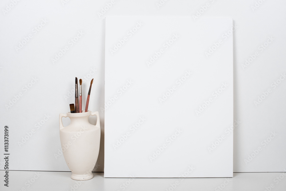 Empty blank canvas on a white background, home interior decor - obrazy, fototapety, plakaty 