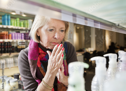 Woman thinking about bying photo