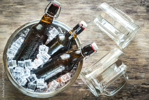 Bottles of beer in ice cubes