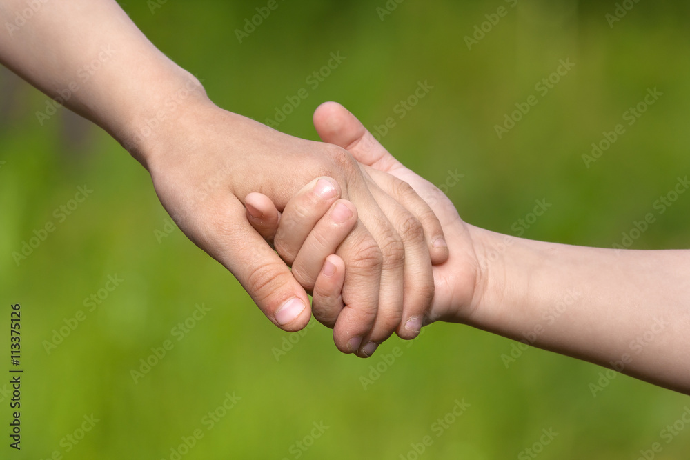 two children holding hands each other, friendship concept two children holding hands each other, friendship concept