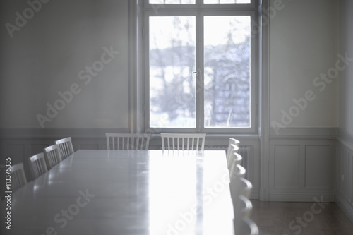 Empty cinference table with sunlight photo