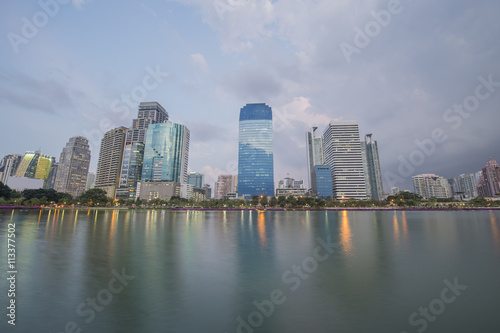 bangkok City view in public park with water reflection during twilight