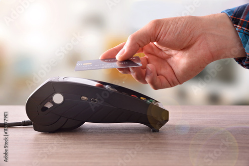 Payment on a trade through contactless card and NFC technology photo
