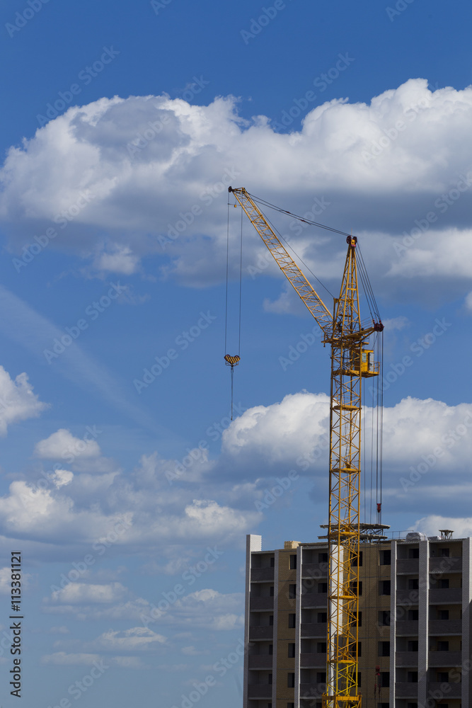 Tower crane on the background of the building is building Tower crane on the background of the building is building