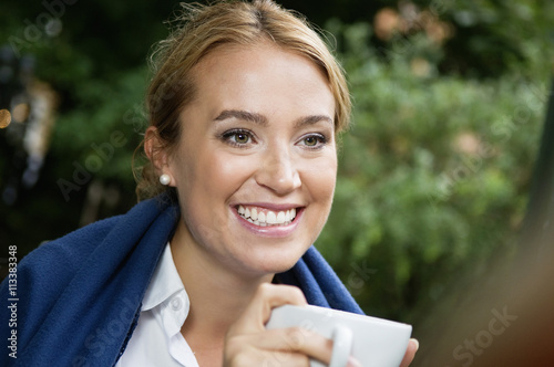 Young woman with coffie photo