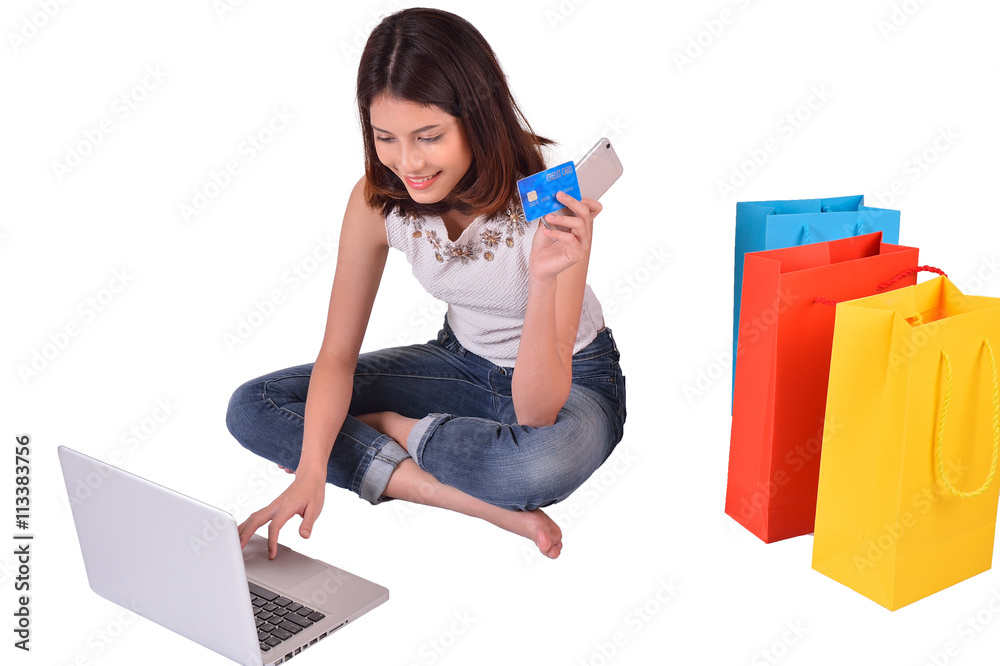 Internet of things, Shopping online, business online. Hand holding credit card doing business on line with laptop PC with clipping path Internet of things, Shopping online, business online. Hand holding credit card doing business on line with laptop PC with clipping path