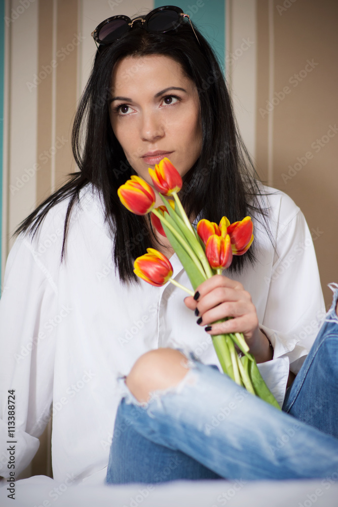 Black haired young woman in her bed in the morning Black haired young woman in her bed in the morning