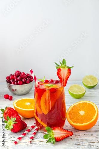 Refreshing summer drink sangria with fruits and berries