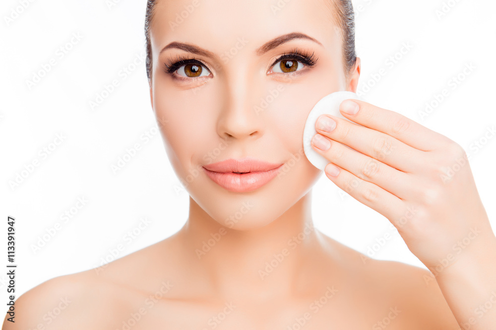 Pretty sensitive girl wash off makeup with cotton pad Pretty sensitive girl wash off makeup with cotton pad